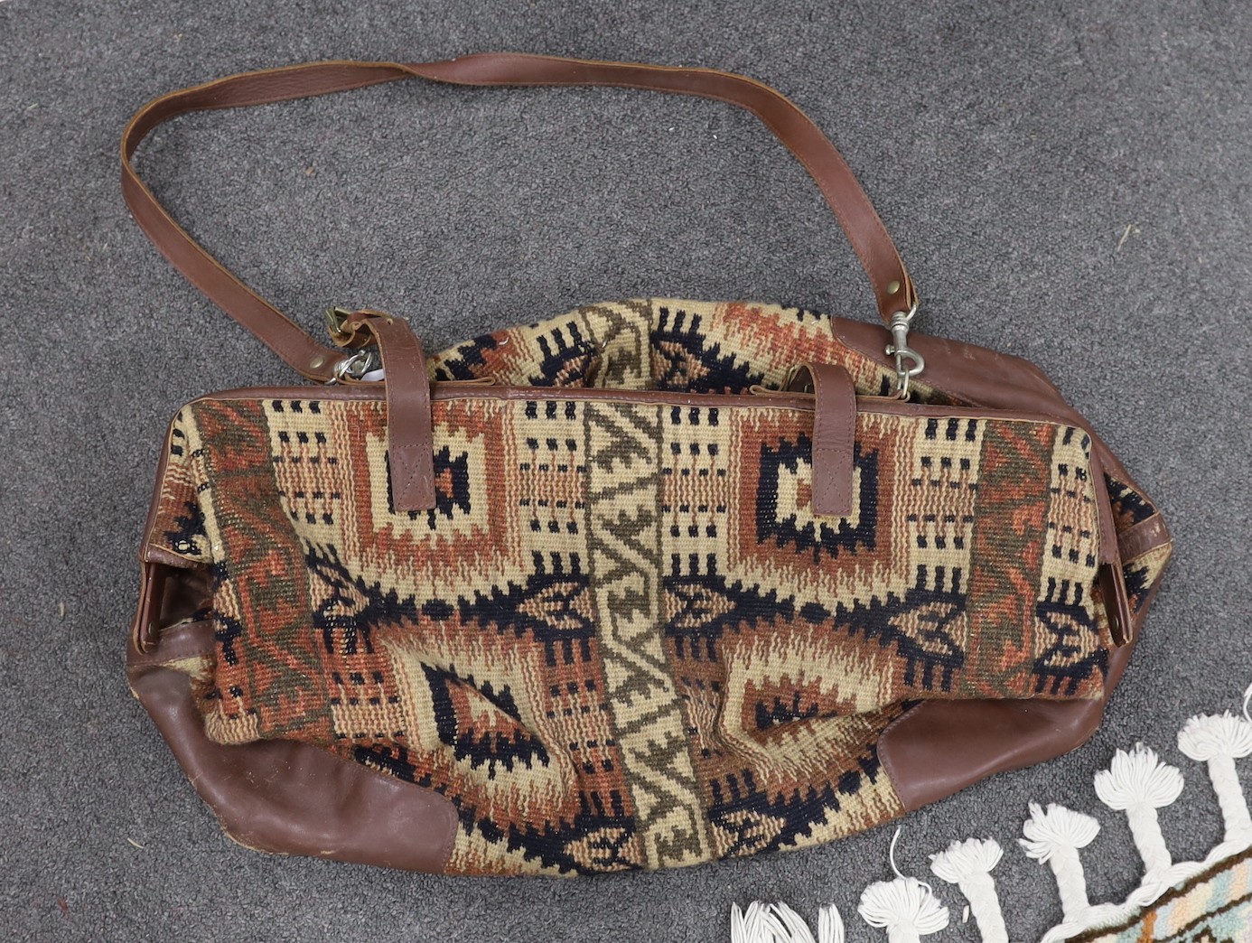 A 20th century vintage carpet bag, base 55cms wide